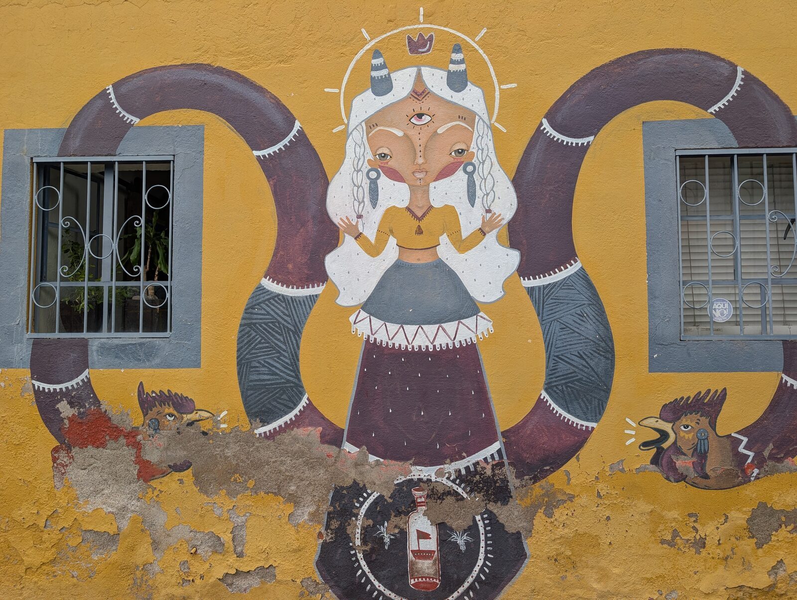 Three-eyed horned woman