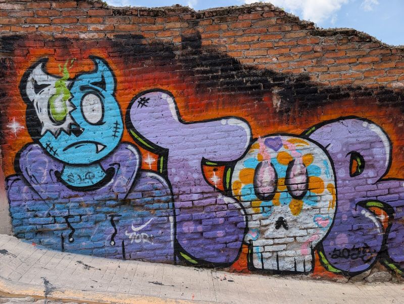 Cyclops and sugar-skull letters