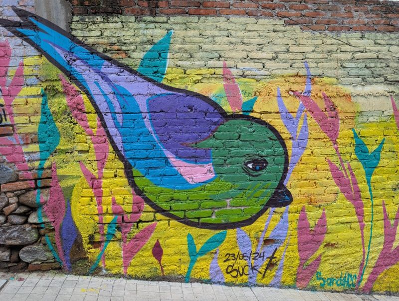 Diving blue-green bird
