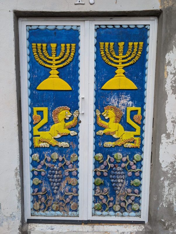 Menorahs and lions door