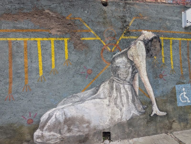 Bowing woman in white
