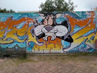 Gato de caricatura asomándose