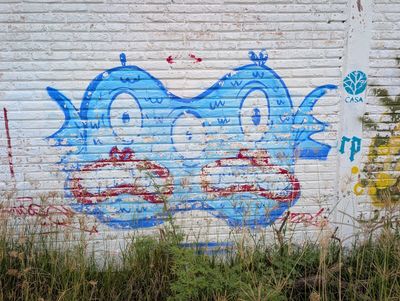 Three-eyed blue creature