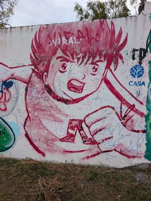 Futbolista de anime en rojo