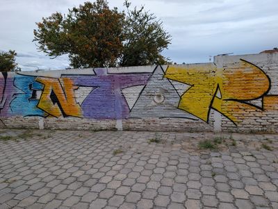 Block-letter piece with an eye