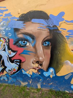 Blue-eyed face in water